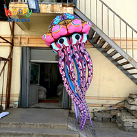 Modèle publicitaire géant gonflable personnalisé en forme de méduse à motifs, avec tentacules colorés, pour la décoration de défilés et festivals