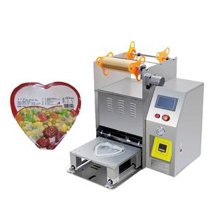Machine de scellage semi-automatique pour barquettes de jus de fruits, de boissons, de thé, de boîtes à lunch et de barquettes alimentaires - Product Image 1