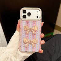 Coque de téléphone rigide magnétique en TPU mat effet premium avec strass en forme de cœur et nœud, ornée de perles de style nouveau pour iPhone 18