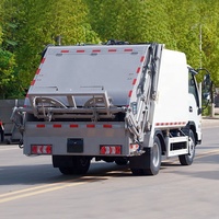 Camion de compression des déchets JAC 6CBM à alimentation automatique, camion de manutention de conteneurs à déchets, camion de ramassage des ordures ménagères pour l'assainissement communautaire