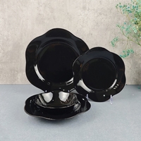 Service de table en céramique 24 pièces Bordure coupée Assiette noire Bol avec glaçure colorée Forme de fleur Service de table