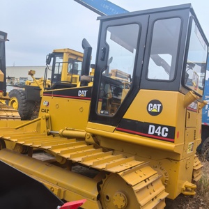 รถตักล้อยางแคตเตอร์พิลลาร์ รุ่น D4C พร้อมใบมีดและรางตีนตะขาบ สีเหลือง อุปกรณ์ก่อสร้าง น้ำหนักบรรทุก 7 ตัน กำลัง 60 กิโลวัตต์ - Product Image 2
