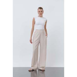 Puane Women's Comfortable Elastic Waist Wide Leg Loose Fit <b>Flowy</b> Trousers - Stylish Beige Casual Pants for All Seasons - Product Image 1