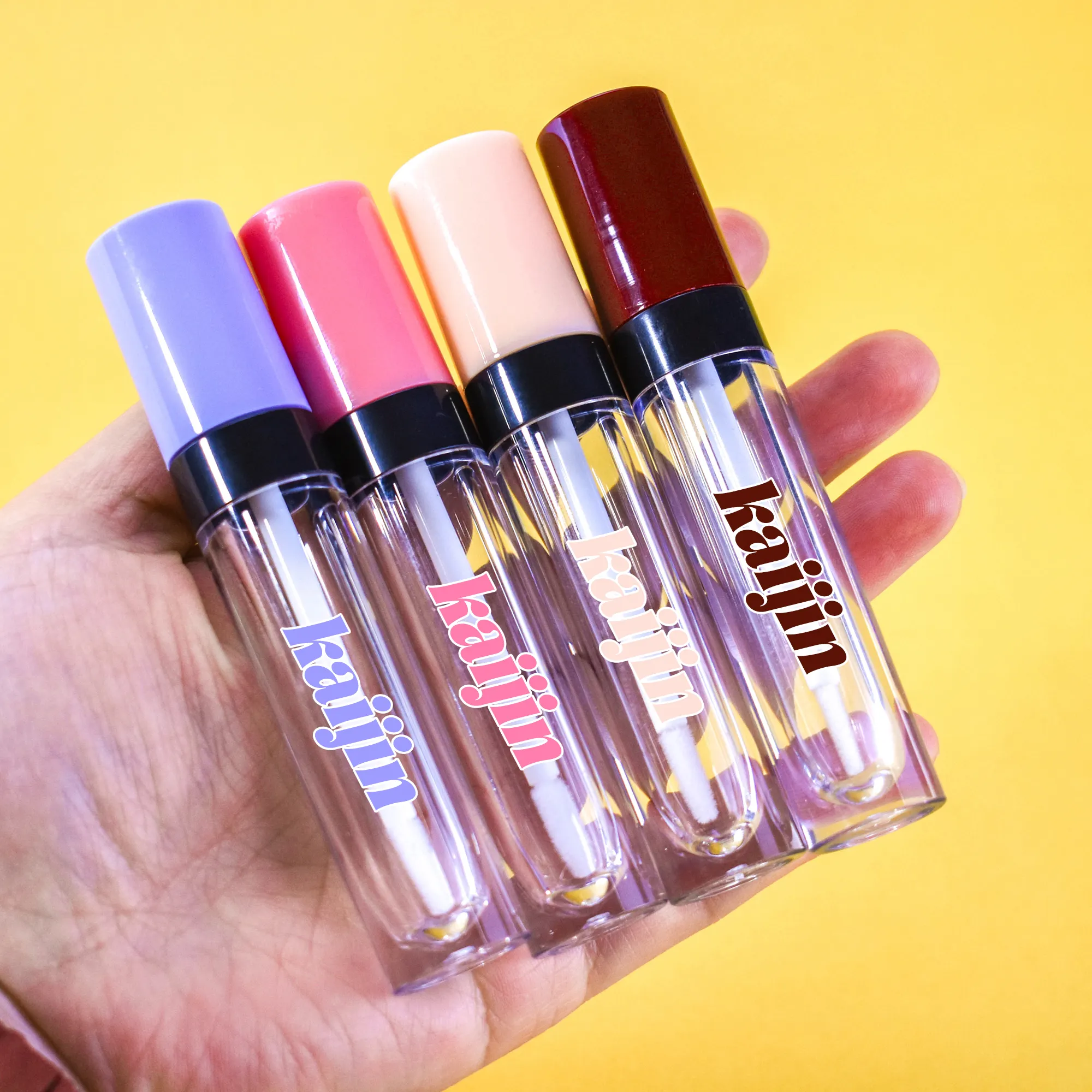 Envases de tubos de brillo de labios redondos de cilindro vacío de 5ml al por mayor con cuello rosa púrpura negro superior para embalaje de brillo de labios
