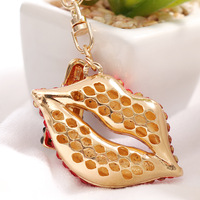 Porte-clés élégant en métal avec pendentif en forme de sac, symbole de luxe, avec strass 3D pour couple, pour baume à lèvres brillant pour femme