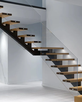 Escalier flottant sur mesure à poutre unique pour villa, avec balustrade en verre trempé