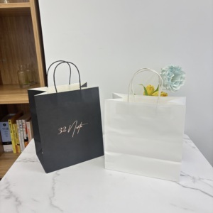 ورق كرافت فاخر مخصص مع كيس تعبئة هدايا أسود غير لامع شعار فويل للملابس والأحذية - Product Image 5