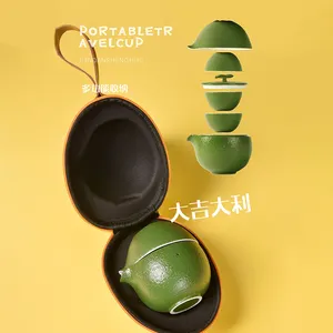 Set Teh Travel Portabel Kung Fu Cina Kreatif dengan Desain Oranye Warna Hijau Satu Pot Tiga Cangkir untuk Piknik Luar Ruangan dengan Tas