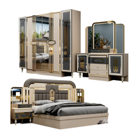 Ensemble de chambre à coucher moderne de luxe en bois rembourré avec lit king-size à LED, armoire et coiffeuse pour villa et hôtel