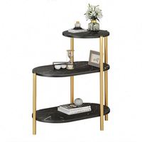 Table basse de style italien avec plateau en pierre frittée arrondi et structure métallique pour salon, balcon, coin canapé