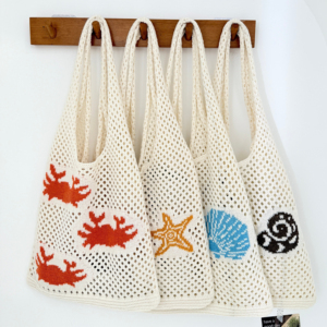 2025 sonbahar koleksiyonu kadın dayanıklı örme tığ Tote plaj çantası büyük kapasiteli açık okyanus elemanları delikli örgü toptan - Product Image 1