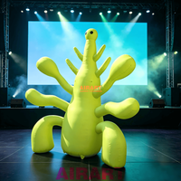 Créature extraterrestre gonflable géante vert lime pour scène de festival de musique, monstre gonflable à tentacules sur mesure pour décoration d'événements extérieurs