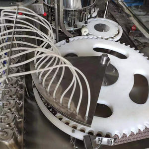 Línea pequeña de aceite caliente para botellas y llenador de barrena líquida <span class=keywords><strong>Macasa</strong></span> Cream Coudre Pour Fille De 9Ans máquina de llenado - Product Image 4