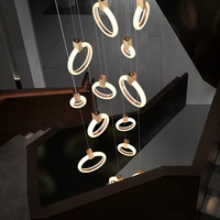 Nouveau design Long escalier suspendu anneaux lumineux rond Led cercle Double hauteur lustre pour la maison
