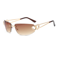 Lunettes de soleil œil-de-chat sans monture pour femmes, monture métallique double cœur évidé, verres dégradés UV400, style mode urbain, vente en gros