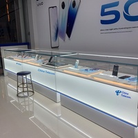 Nouvelle vitrine pour téléphones portables avec éclairage LED en verre, fonction lumineuse pour montres et lunettes, rangement multifonctionnel portable doré