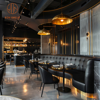 Ensemble de meubles de restaurant Ron Group Luxury : table ronde en marbre, chaise en cuir capitonnée, banquette incurvée.