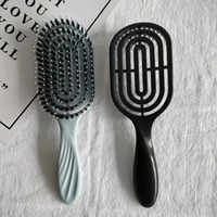 2023 boucle personnalisée démêlant brosse à cheveux moderne 12 pagaie peigne forme ovale poils de sanglier rembourré Compact bouclés pagaie Logo personnalisé