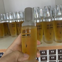 Sérum capillaire Armalla OEM à la kératine organique et à l'huile d'argan du Maroc avec gingembre et huile de coco pour cheveux abîmés
