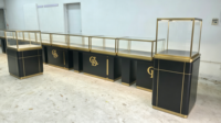 Comptoir de présentation de bijoux noir et or personnalisé avec éclairage LED et verre verrouillable pour magasin de détail
