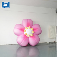 Modèle publicitaire gonflable personnalisé en forme de fleur rose pour la promotion commerciale extérieure printanière