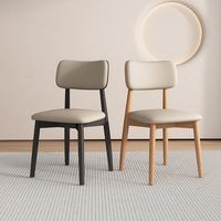 Chaise de salle à manger noire minimaliste moderne avec rembourrage confortable et pieds robustes, design élégant pour la maison, les restaurants et les hôtels