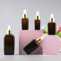 Flacon carré ambré vide de 30 ml (1 oz) pour emballage cosmétique, huile essentielle, teinture pour les yeux, sérum pour le visage avec compte-gouttes doré