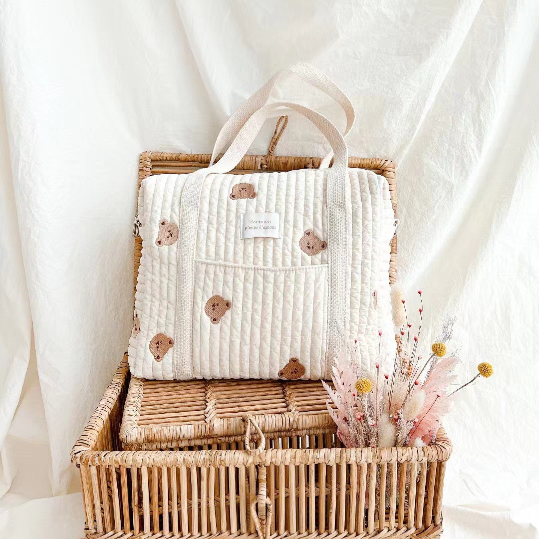 Ours de taille de M avec la poche/32*25*12cm