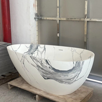 Baignoire autoportante en forme d'oeuf en marbre blanc de luxe Baignoire de trempage en pierre artificielle solide au design moderne pour hôtels