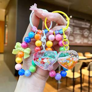 Porte-clés personnalisé avec perles et paillettes liquides, cœur et nœud arc-en-ciel, sangle de téléphone Kawaii pour filles, cadeau d'anniversaire pour adolescentes, vente en gros - Product Image 1