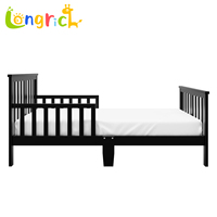 Lit pour tout-petit en bois noir avec barrières latérales doubles, construction en bois de pin et composite, compatible avec les matelas standard pour tout-petit