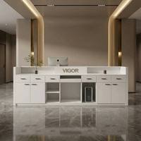 Bureau d'accueil moderne blanc crème avec bande lumineuse LED, comptoir de réception minimaliste pour bureau, salon, clinique de beauté