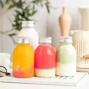 Vaso de plástico Botellas de jugo Botella de jugo de plástico <span class=keywords><strong>PET</strong></span> vacía Botella de bebida redonda única transparente sin BPA con tapas - Product Image 5