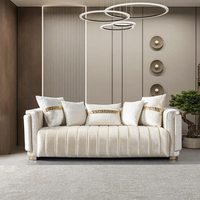 Canapé convertible moderne de luxe confortable à trois places avec pieds en acier inoxydable pour appartements et salons d'hôtel