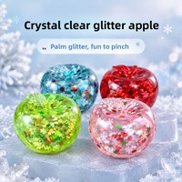 Jouet souple translucide Pomme de Noël avec tige courte et feuille supérieure, finition brillante transparente avec flocons et paillettes à l'intérieur, anti-stress