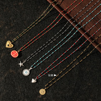 Collier superposé délicat style bohème en acier titane plaqué or PVD 18K avec perles colorées multi-formes, breloques cœur, étoile et pièce de monnaie