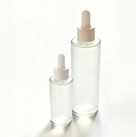 Flacon en verre ambré rond de 50 ml/100 ml avec pipette, opaque, givré, imprimé avec le logo YOGO, pour les gouttes pour les yeux