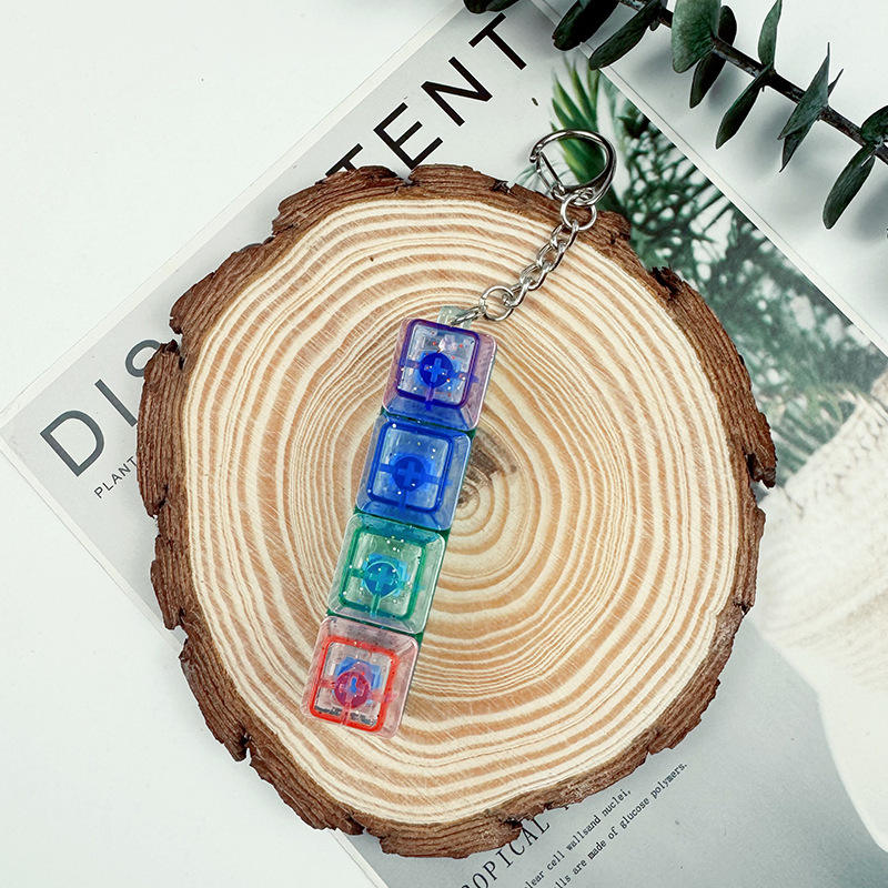 Tira mixta de tapa de color de carcasa transparente de cuatro teclas