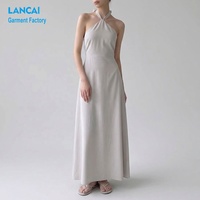 Produsen Gaun Maxi A-Line Wanita Model Halter Neck untuk Tamu Pernikahan dengan Saku Samping Tersembunyi OEM ODM