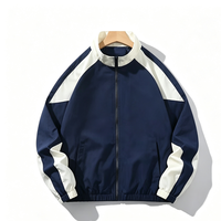 Blouson Bomber Homme Col Montant Patchwork Color Block Manches Raglan Imperméable Coupe-Vent Zippé Vêtement d'extérieur Décontracté Sportif Ample