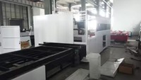 Machine de découpe laser à fibre CNC Hoysook 3015 avec table d'échange intégrée pour tôles en acier au carbone, acier inoxydable et aluminium