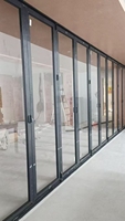 Porte pliante en verre extérieur ultra-mince au design moderne à vision intégrale pour l'extension des espaces extérieurs des maisons semi-attachées