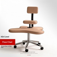 Chaise de sol robuste au design moderne et minimaliste, avec assise rembourrée et roulettes, idéale pour poser les jambes