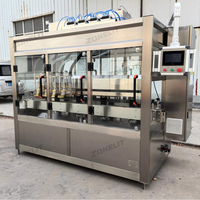 Servopompe à 4 buses Machine de remplissage automatique de liquide visqueux pour le suivi des bouteilles d'huile moteur avec convoyeur