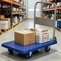 Chariot à plateforme en plastique à quatre roues, robuste, pour les opérations logistiques d'entrepôt et d'usine