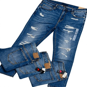 Pantalones vaqueros jogger de mezclilla azul desgastado para hombre, talla 29-40, largo regular, con bajo MOQ, stock excedente de 5.8 dólares - Product Image 1
