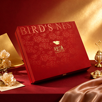 Boîte Cadeau Luxe Rigide Nid d'Oiseau Rouge et Or avec Logo Doré Motif Nuage et Plateau Intérieur en Velours Noir pour Emballage Santé