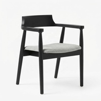 Fauteuil en bois massif de style mid-century, revêtement en cuir, assise rembourrée, accoudoirs incurvés, dossier de soutien, salle à manger, salon, réception