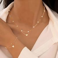 Ensemble de bijoux élégant à double couche de perles empilées en forme de cœur, bracelet et collier en or et argent