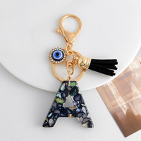 Porte-clés en résine Alphabet avec œil turc bleu, strass et pompon, breloque de sac à main, porte-clés personnalisé avec initiale, bijou fantaisie, cadeau